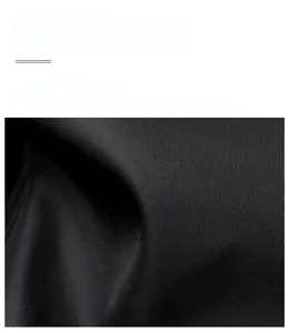 Close-up of black twill woven synthetic fiber with a subtle silk gloss and durable texture