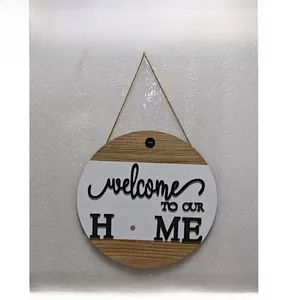 Detail of wooden welcome sign featuring a white insert and 3D wood grain typography