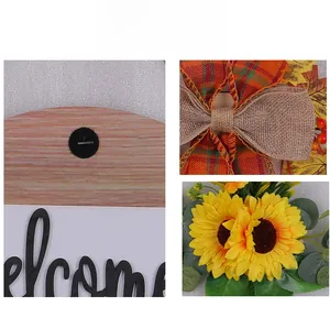 Detail of rustic welcome sign showing burlap bow, autumn leaves and sunflower textures