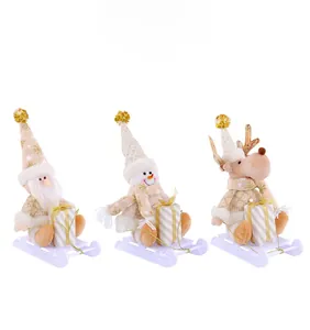 Detailed view of plush Santa, Snowman and Reindeer figurines on white plastic sleds