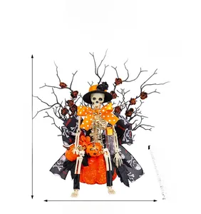 Detailed Halloween decor featuring skeleton on pumpkin with black branches and orange flowers