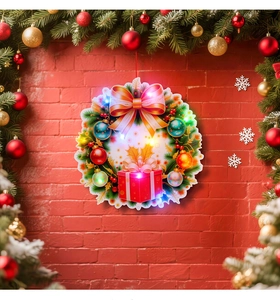 Close-up of lighted Christmas wreath with colorful LED bulbs on red brick wall