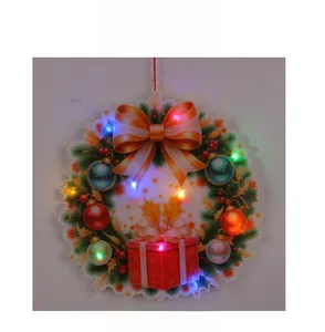 Close-up of lighted Christmas wreath with colorful LED bulbs and festive ornaments