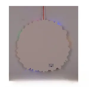 Rear view of light-up Christmas wreath showing battery compartment and LED glow
