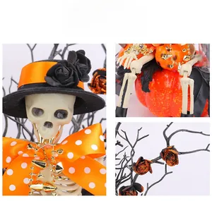Detail of Halloween skull with black rose hat and orange polka dot bow decoration