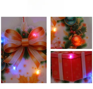 Close-up of LED Christmas door hanger with red bow and festive holiday lights