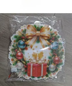 Detailed view of LED Santa door hanger in protective plastic packaging with battery box
