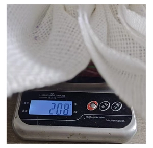 Detailed view of the linen sunflower wreath weight measurement on a scale showing 208g