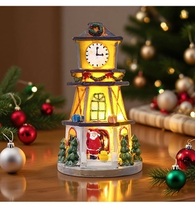 Detailed view of LED glowing resin Christmas bell tower with Santa Claus and warm lighting