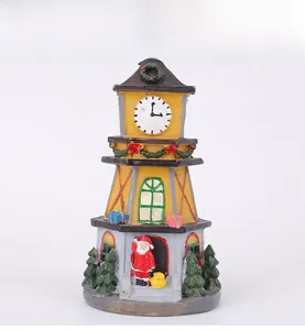 Detailed view of LED Christmas resin clock tower featuring Santa and miniature trees