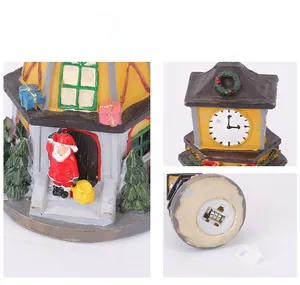 Macro details of LED Christmas resin clock tower showing base and clock face