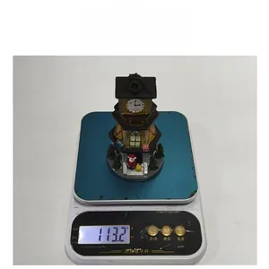Detailed view of LED Christmas resin clock tower showing its weight of 113.2g
