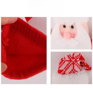 Detail of red knit Christmas Santa candy bag with white fleece lining and plush finish