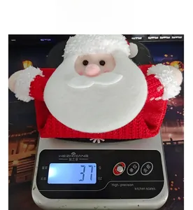 Weight measurement of cute knitted Santa Claus candy gift bag showing 37g on scale