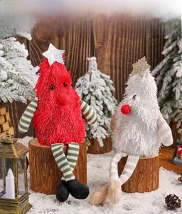 Close-up of Christmas tree gnome plushies with star toppers on rustic wooden logs