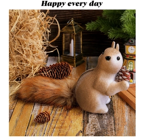 Detailed view of artificial squirrel decor holding a pinecone on a rustic wooden table