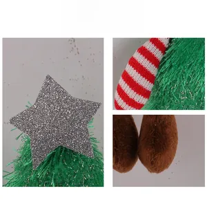 Detail showing multi-texture plush Christmas tree with star sequin and knit fabric