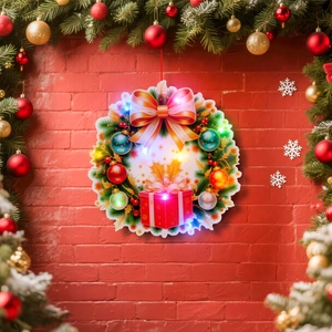 Illuminated Christmas LED wreath door hanging with festive red bow and colorful ornaments