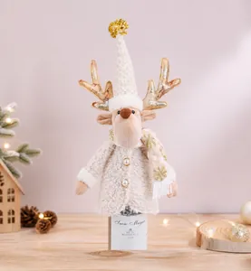 Detail of reindeer wine bottle cover featuring faux fur and knitted scarf with gold antlers