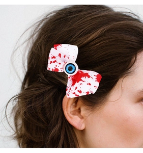 Pinza para el pelo de Halloween con lazo sangriento y detalle de ojo azul en el cabello
