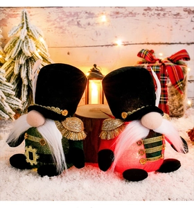 Detail of Nutcracker style Christmas gnomes with sequins and velvet on a snowy background