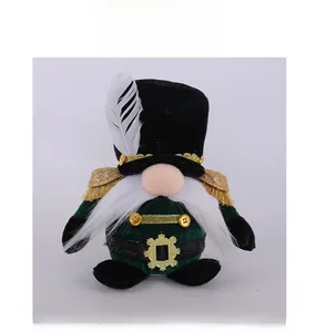 Detailed view of nutcracker gnome plush with gold epaulettes and green soldier hat