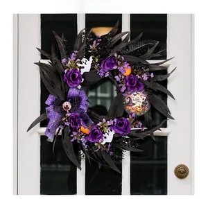 Halloween wreath with purple roses and ghosts hanging on a white wooden lattice door