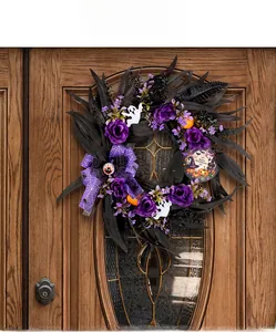 Halloween wreath on wooden door with purple roses, black feathers and spooky ghost decor