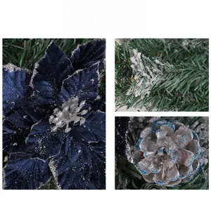 Macro detail of velvet blue Christmas flower with silver glitter and snowy pine cones