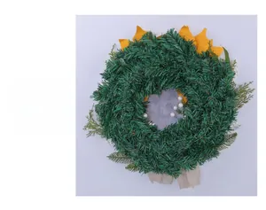 Detailed back view of a sunflower Christmas wreath with pine needles and burlap bow