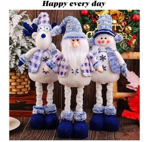 Three plush Christmas figurines with telescopic long legs in blue plaid holiday theme