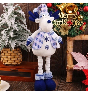 Detailed view of plush Christmas reindeer ornament with blue plaid vest and scarf
