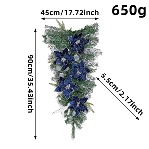 90cm Christmas Teardrop Swag with blue poinsettia flowers and white flocked pine needles