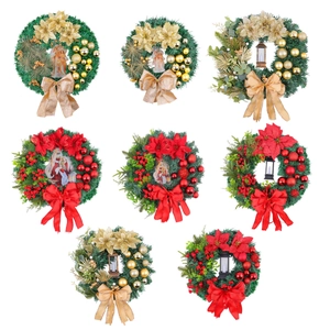 Eight decorative Christmas wreaths with red bows, berries, and vintage lanterns on white background