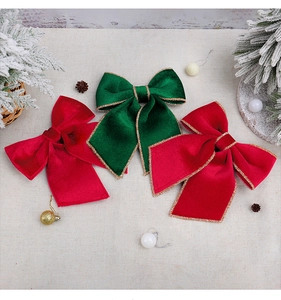 Close-up of velvet festive bows with gold glitter edges for New Year decor