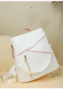 Detailed view of white nylon backpack with pink trim and vertical metal anti-theft zipper