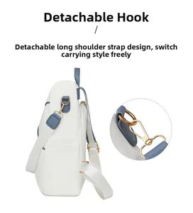 Detail view of durable nylon backpack with metal detachable hooks and wide shoulder straps