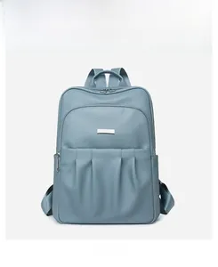 Detailed front view of Morandi blue backpack with lychee leather texture and pleated pocket