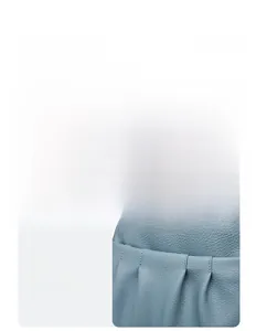 Detailed macro view of light blue lychee pattern leather and metallic logo on backpack