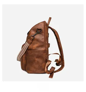 Detail view of dark brown leather backpack side pocket and woven decorative strap