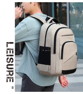 Outdoor shot of men's cream backpack featuring black mesh side pockets and side view
