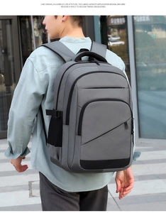 Close-up of a dark grey waterproof commuter backpack with spacious functional compartments
