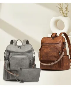 Detail of vintage PU leather backpack featuring ethnic woven straps and a matching tassel