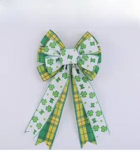 Macro detail of St. Patrick's Day bow with clover patterns and green plaid textures