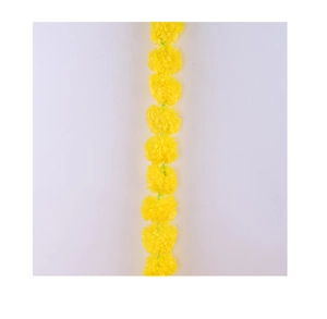 Close-up of yellow artificial marigold garlands for Diwali and Day of the Dead decor