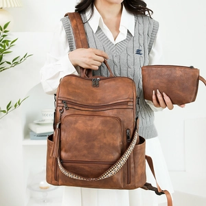 Retro brown PU leather backpack for women with ethnic style strap and small pouch