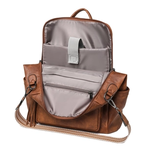 Brown faux leather laptop backpack with ethnic woven strap and spacious compartments