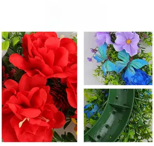 Detail of red silk flowers with blue butterfly accents and sturdy green plastic base