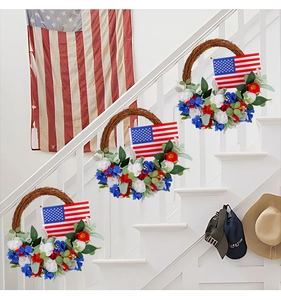 Three USA Independence Day wreaths with stars and stripes on a rustic vine base