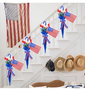 Detail of patriotic umbrella wall hanging with red white tulips and USA flag ribbons